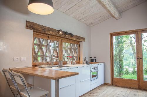 a kitchen with a wooden counter top and a window at Podere Campriano Winery Adult only in Greve in Chianti