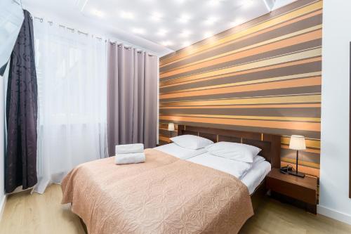 Кровать или кровати в номере Apartament w Diva Spa 250m do plaży