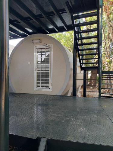 a circular building with a window and a staircase at Meinong Yun Shanju Homestay in Meinong