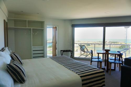 Ένα ή περισσότερα κρεβάτια σε δωμάτιο στο Apart Hotel Ulises - Club de Mar