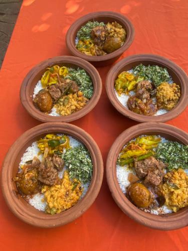 a group of four dishes of food on a table at Settle Inn Tourist Lodge in Kandy