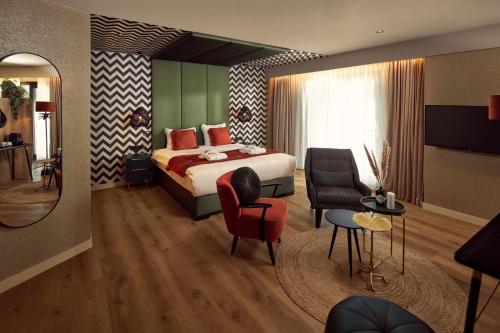Een bed of bedden in een kamer bij Van der Valk Hotel Breukelen