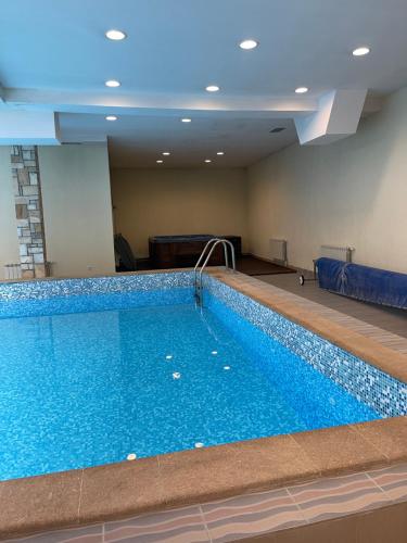 a large swimming pool in a hotel room at Bansko SPA Studio at Predela1 in Bansko