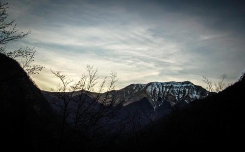a view of a mountain with snow on it at Villa Fedora in Lizzano in Belvedere
