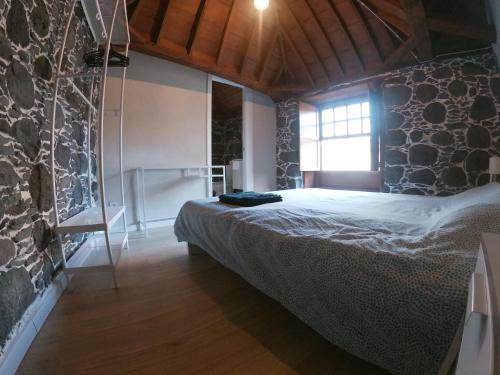 Postel nebo postele na pokoji v ubytování Casa Histórica - Vivienda Vacacional Out of Blue