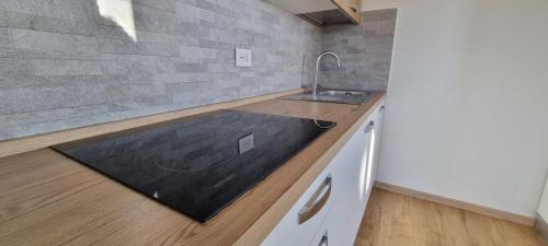 a kitchen with a sink and a counter top at Chalet Sophie - Luxury Chalet in Roletto