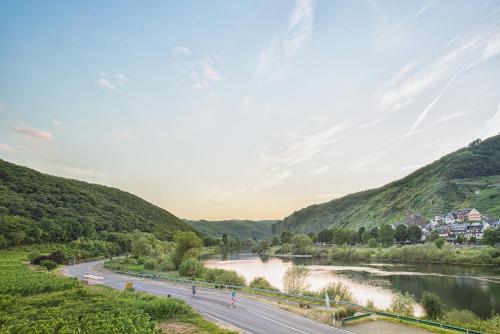 a view of a river and a road in a valley at Hotel Filla Andre in Ernst