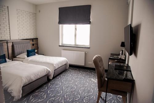 Katil atau katil-katil dalam bilik di Hotel & Spa Pałac Mała Wieś