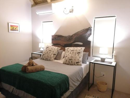 Un pat sau paturi într-o cameră la Amukela Kaya