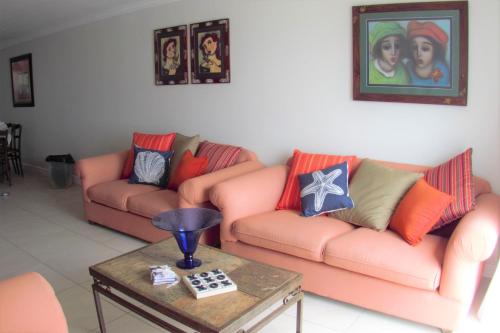 a living room with two couches and a coffee table at Allalapstix in Reebok