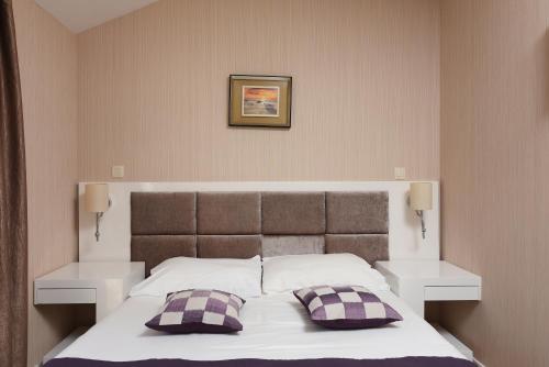 Postel nebo postele na pokoji v ubytování Family Hotel Zanè