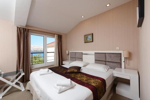 Krevet ili kreveti u jedinici u objektu Family Hotel Zanè