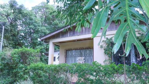 a house with a gate in front of it at Casa Copalchi in Monteverde Costa Rica