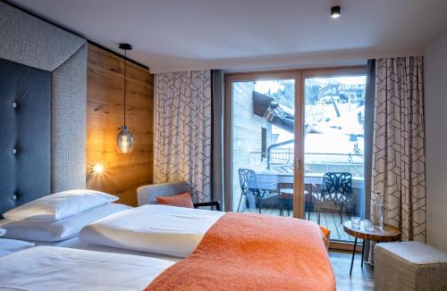 Ένα ή περισσότερα κρεβάτια σε δωμάτιο στο Hotel das Zwölferhaus