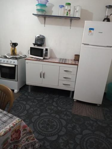 Kuchyň nebo kuchyňský kout v ubytování Nilda Casas e Quartos para Aluguel