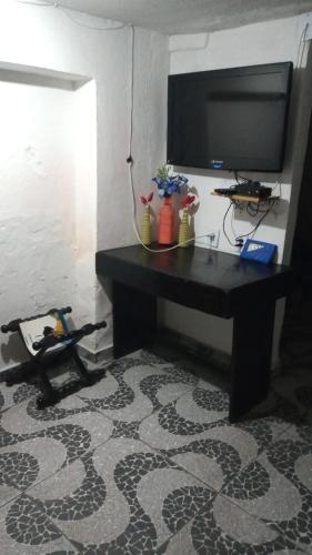 TV a/nebo společenská místnost v ubytování Nilda Casas e Quartos para Aluguel