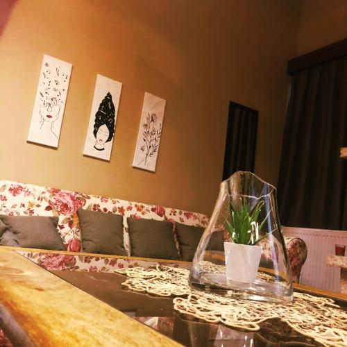a living room with a couch and a table at Soul boutique hotel in Monodendri