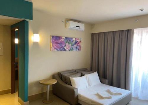 Säng eller sängar i ett rum på Enjoy Solar das Águas Park Resort - Olimpia