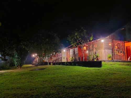 a train is parked in a field at night at Ponta Poranga Jungle Lodge in Manaus