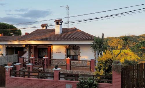 a house with a red brick at Apartamento Can Jaramills in Tordera