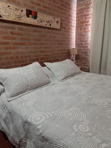 Ένα ή περισσότερα κρεβάτια σε δωμάτιο στο Departamento Estela Marys