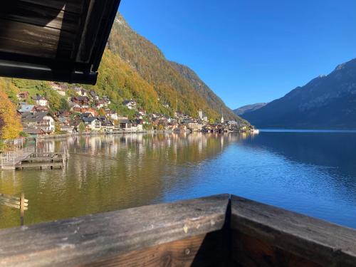 a view of a lake with a town on the shore at Hallstatt Lakeside Top 4 - Zimmer mit Balkon in Hallstatt