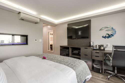 Ένα ή περισσότερα κρεβάτια σε δωμάτιο στο Harbor View Inn