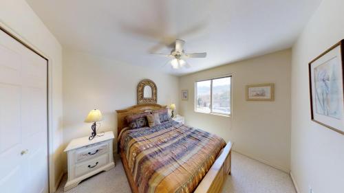 a bedroom with a bed and a ceiling fan at Kokopelli Dream #3251 in Moab