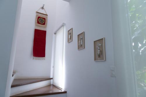 a stairway with a red and white towel hanging on a wall at Luxury Private Villas , Private Pool, Private garden, Jacuzzi, 24hours security in Tulum