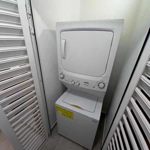 a computer monitor sitting on top of a toilet at Villas Frida Kahlo in Bucerías