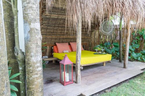 a bed in a gazebo on a patio at Luxury Private Villas , Private Pool, Private garden, Jacuzzi, 24hours security in Tulum