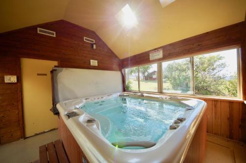 a large tub in the middle of a room at Pack Creek ~ Farm House in Moab