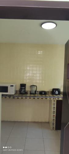 a kitchen with pots and pans on a counter at Casa Armony in Cuernavaca