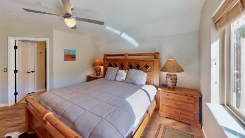 a bedroom with a large bed and a window at Red Cliff Condos #3E in Moab