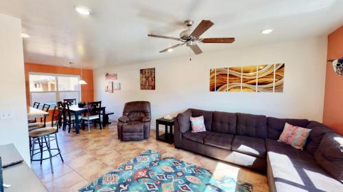 a living room with a couch and a dining room at Slick Rock Reserve #12A3 in Moab