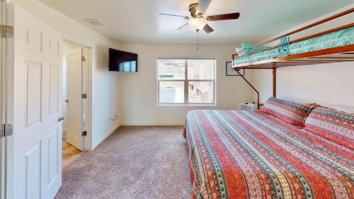 a bedroom with a bed and a ceiling fan at Slick Rock Reserve #12A3 in Moab