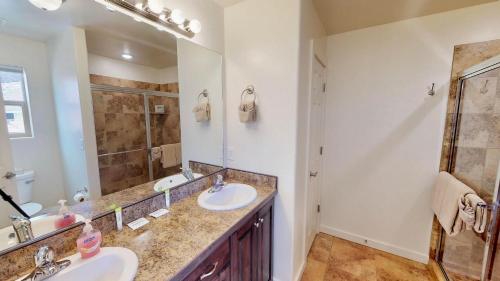 a bathroom with two sinks and a shower at Slick Rock Reserve #12A3 in Moab