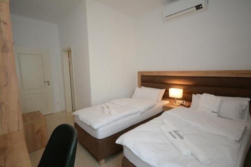Letto o letti in una camera di Hannover Zimmervermietung Mardino