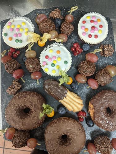 a bunch of donuts and other desserts on a table at Rheinauer Hof - bed & breakfast in Mannheim