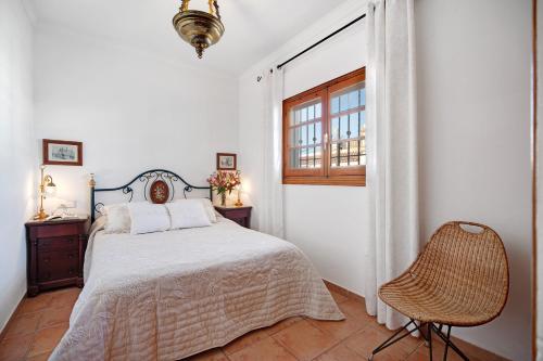 A bed or beds in a room at Caracola Apartment