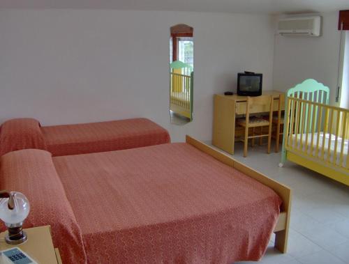 Cama o camas de una habitación en Hotel Svizzero