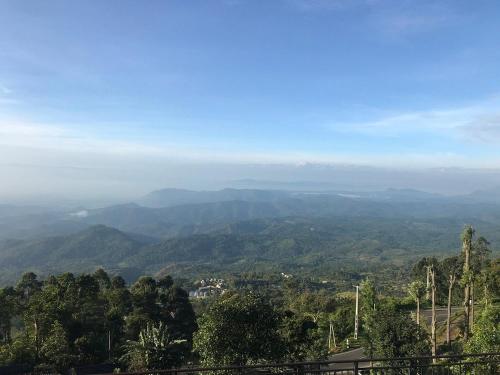 a view of a valley with mountains in the distance at eSKPe to Blackwood in Haputale