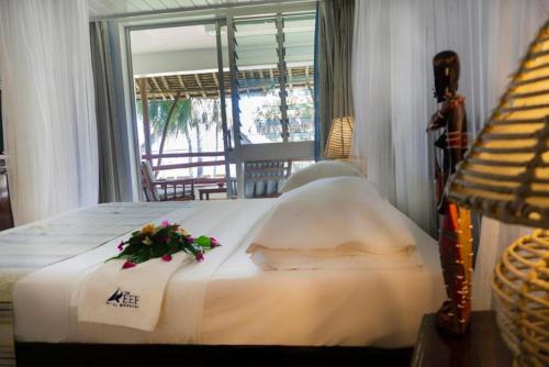 Ein Bett oder Betten in einem Zimmer der Unterkunft Reef Hotel Mombasa