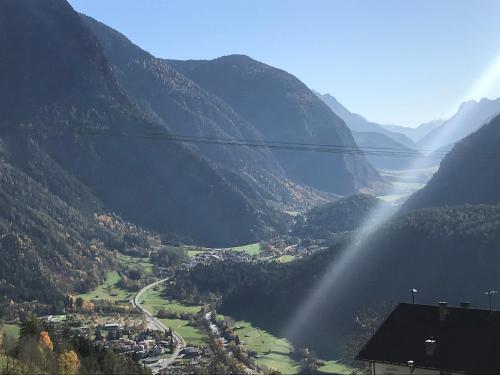 a view of a valley with a river and mountains at Alpenblick de Luxe in Oetz