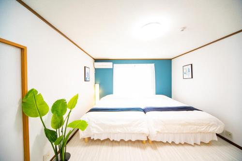 Postel nebo postele na pokoji v ubytování Awaji Seaside Resort in Sumoto