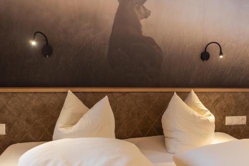 Кровать или кровати в номере Sonnenhof - Apartments & Zimmer