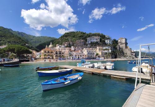a group of boats docked at a dock in the water at Casa Angelica Cetara Albergo Diffuso in Cetara