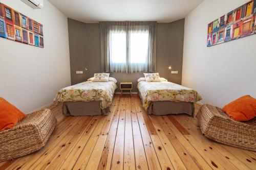 Postel nebo postele na pokoji v ubytování Apartamentos Alfonso X