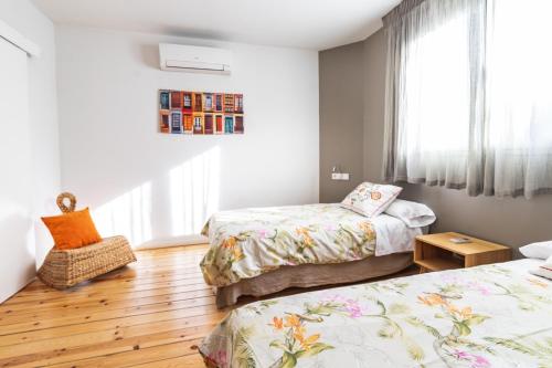 Katil atau katil-katil dalam bilik di Apartamentos Alfonso X