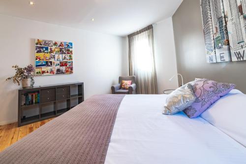 Katil atau katil-katil dalam bilik di Apartamentos Alfonso X